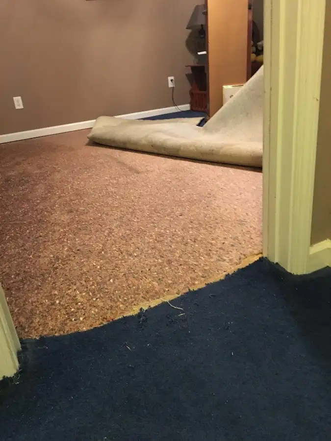 Carpet pad removal revealing water damage during Drying & Dehumidification in Duncan